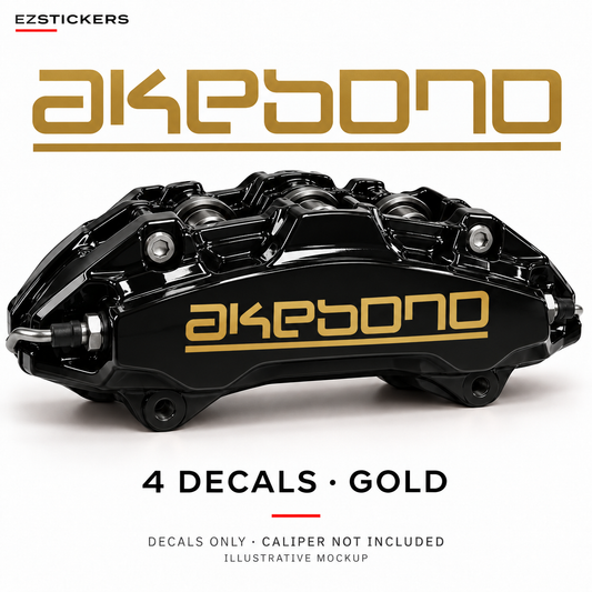 EZSTICKERS illustrative caliper mockup for Akebono caliper decals — Gold, showing the referenced manufacturer/model lettering in Gold; decals only, caliper not included.